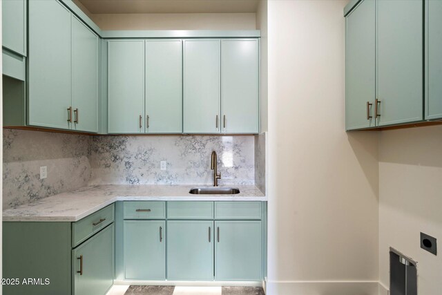 3323 N 81st St, Mesa, AZ 85207 - kitchen with a sink, green cabinetry, and backsplash