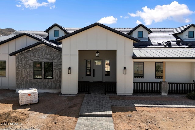 3323 N 81st St, Mesa, AZ 85207 - modern farmhouse featuring a porch, board and batten siding, a standing seam roof, and metal roof