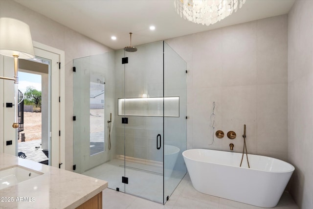 3323 N 81st St, Mesa, AZ 85207 - full bathroom featuring vanity, a stall shower, a freestanding bath, tile patterned floors, and recessed lighting