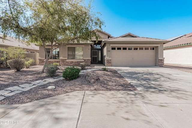 2268 S 162nd Ln, Goodyear, AZ 85338 - ranch-style home with stucco siding, an attached garage, and stone siding
