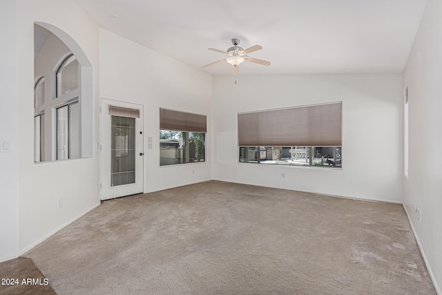 2268 S 162nd Ln, Goodyear, AZ 85338 - spare room with baseboards, ceiling fan, lofted ceiling, and carpet
