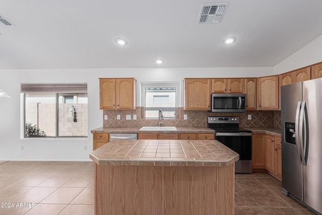 2268 S 162nd Ln, Goodyear, AZ 85338 - kitchen with appliances with stainless steel finishes, visible vents, tile patterned flooring, and a sink