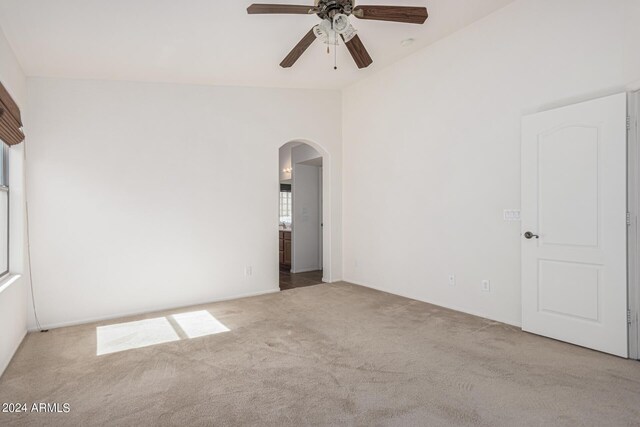 2268 S 162nd Ln, Goodyear, AZ 85338 - unfurnished room featuring carpet, a ceiling fan, and arched walkways