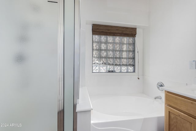 2268 S 162nd Ln, Goodyear, AZ 85338 - bathroom featuring a shower stall, a garden tub, and vanity