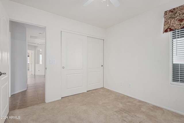 2268 S 162nd Ln, Goodyear, AZ 85338 - unfurnished bedroom with carpet, a closet, baseboards, and multiple windows