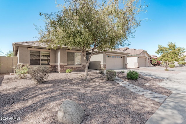 2268 S 162nd Ln, Goodyear, AZ 85338 - ranch-style home with stucco siding, a tiled roof, fence, driveway, and an attached garage