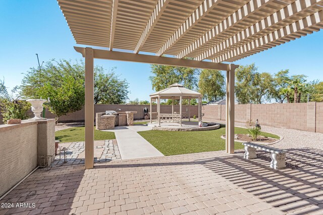 2268 S 162nd Ln, Goodyear, AZ 85338 - view of patio with a gazebo, exterior kitchen, and a fenced backyard