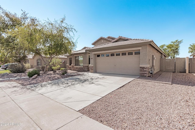 2268 S 162nd Ln, Goodyear, AZ 85338 - ranch-style house with stucco siding, driveway, an attached garage, and stone siding