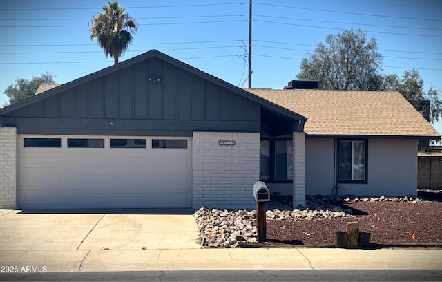 5529 W Zoe Ella Way, Glendale, AZ 85306 - ranch-style house with a shingled roof, concrete driveway, brick siding, and an attached garage