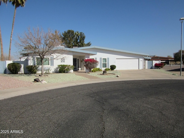 ranch-style home featuring a garage