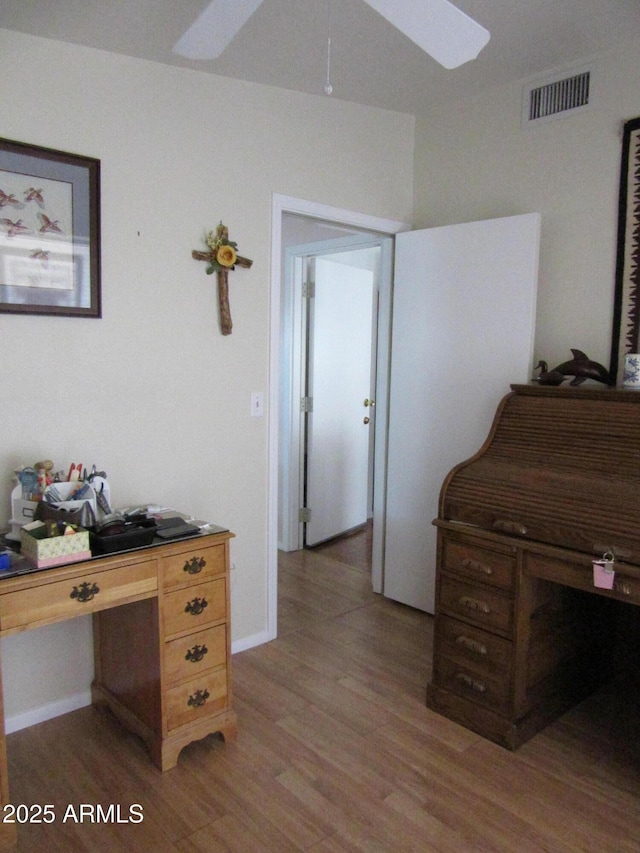 office featuring hardwood / wood-style flooring and ceiling fan