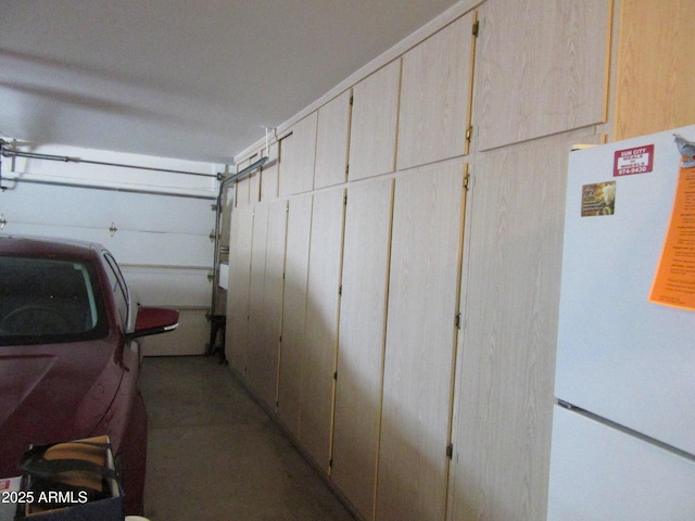 garage with white refrigerator