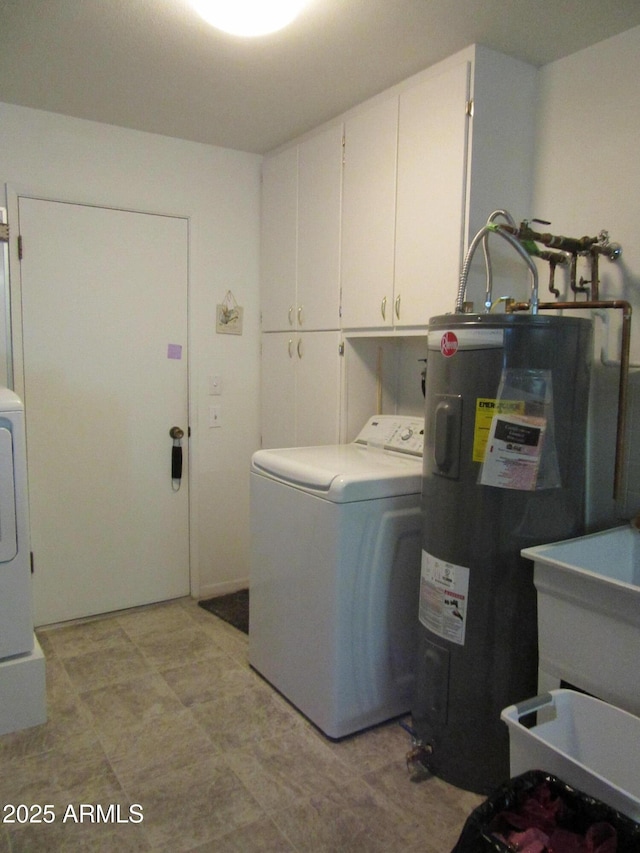 laundry area featuring cabinets, washer / clothes dryer, and water heater