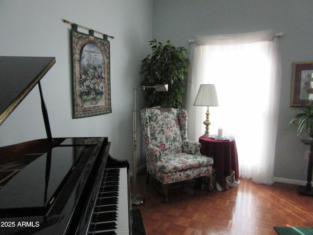 living area with parquet flooring