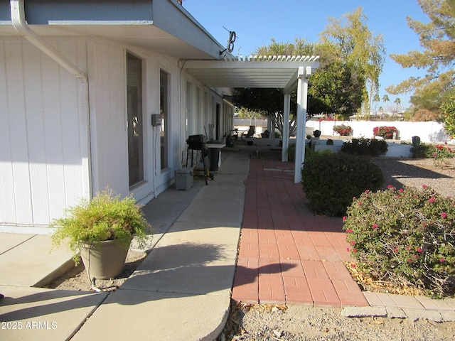 view of patio / terrace featuring a grill and a pergola