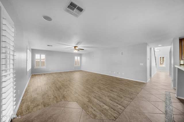 unfurnished room featuring ceiling fan and light hardwood / wood-style flooring