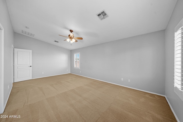 unfurnished room featuring ceiling fan, carpet floors, and lofted ceiling