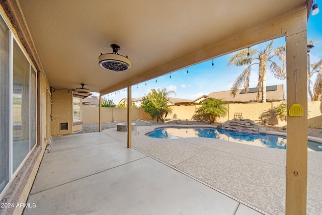 view of swimming pool with a patio area