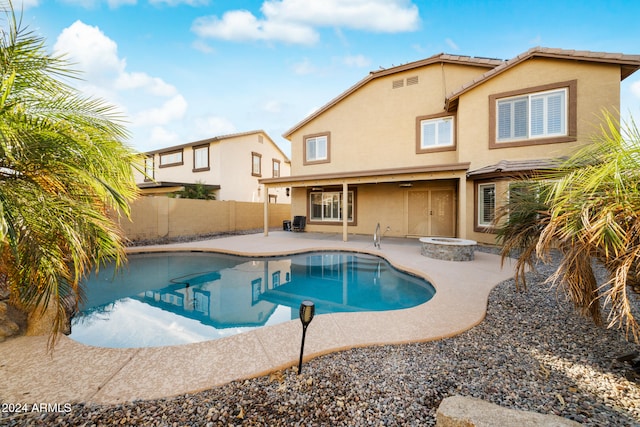 view of pool with central air condition unit and a patio area