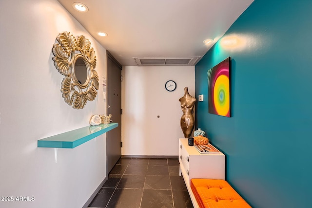 207 W Clarendon Ave Unit G18, Phoenix, AZ 85013 - hallway with dark tile patterned flooring and recessed lighting