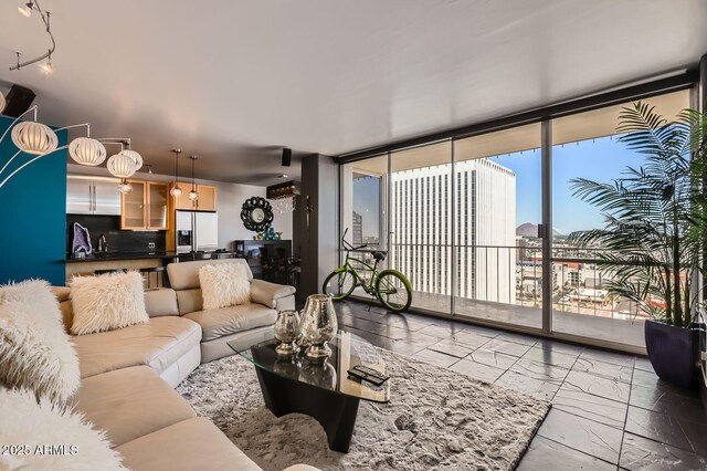 207 W Clarendon Ave Unit G18, Phoenix, AZ 85013 - living room with a wall of windows and marble finish flooring