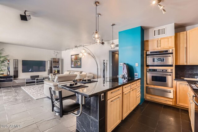 207 W Clarendon Ave Unit G18, Phoenix, AZ 85013 - kitchen featuring a warming drawer, light brown cabinetry, rail lighting, dark countertops, and open floor plan