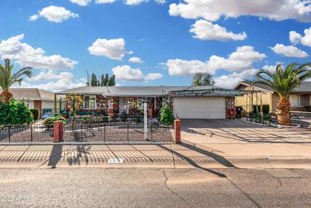 ranch-style house with a garage, driveway, and a fenced front yard