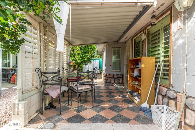 view of patio / terrace featuring fence and outdoor dining area