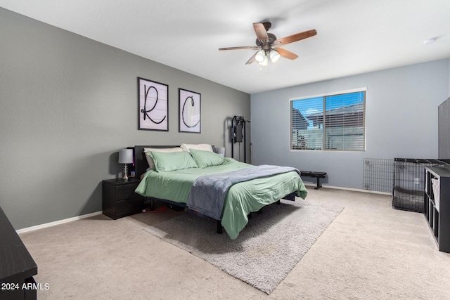 bedroom featuring light carpet and ceiling fan