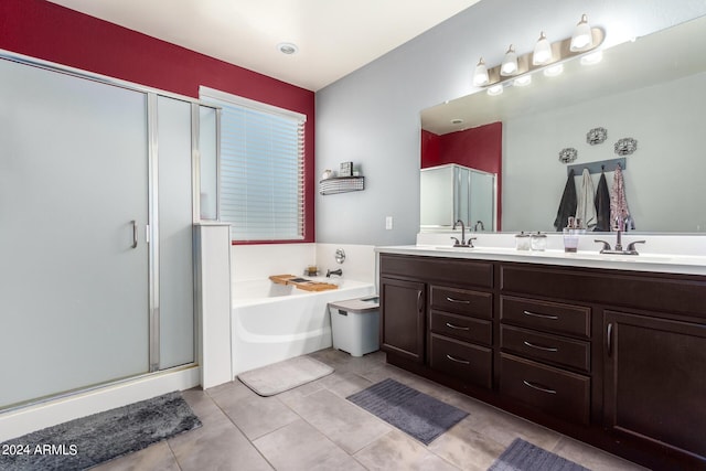 bathroom featuring vanity, tile patterned floors, and plus walk in shower