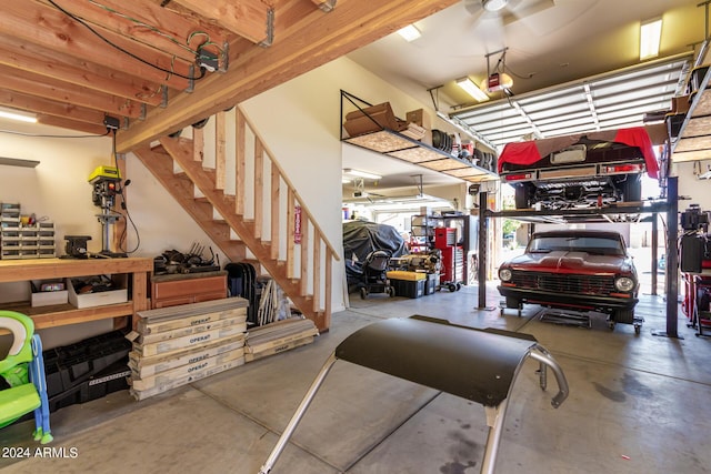 garage featuring a garage door opener and a workshop area