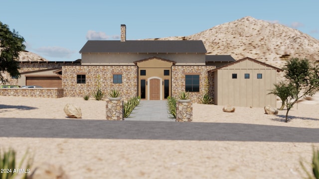 view of front of home featuring a garage and a mountain view