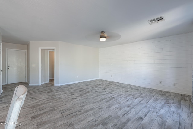 unfurnished room with ceiling fan and light wood-type flooring