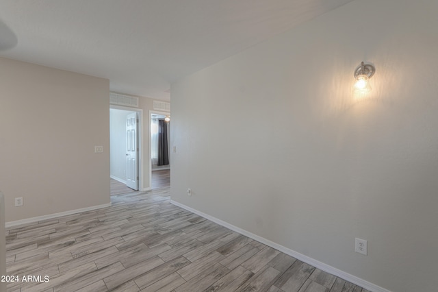 empty room with light wood-type flooring