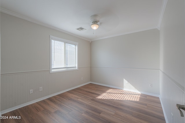 unfurnished room featuring ornamental molding, hardwood / wood-style floors, and ceiling fan