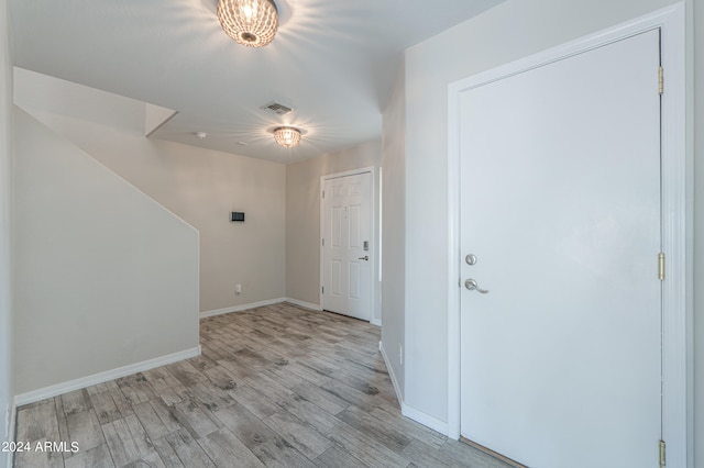 entrance foyer with light hardwood / wood-style flooring