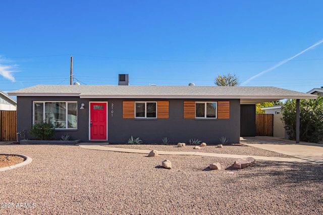 single story home with a carport