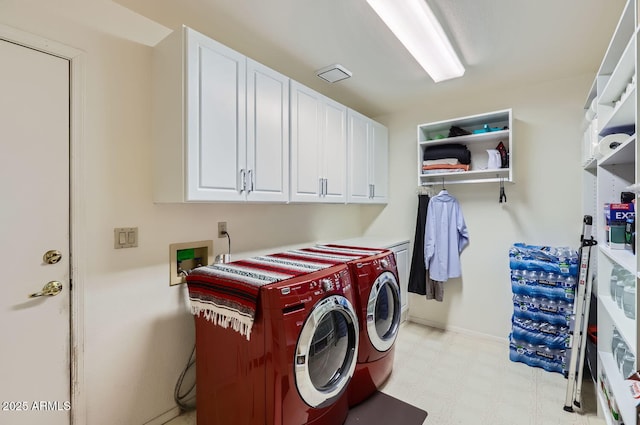 laundry area featuring cabinets and separate washer and dryer