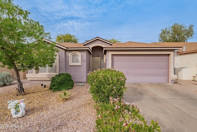 ranch-style house featuring a garage