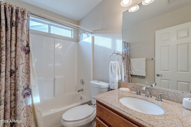 full bathroom with vanity, toilet, and shower / bath combo with shower curtain