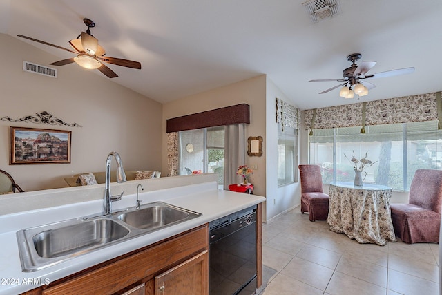 kitchen featuring dishwasher, light tile patterned floors, and sink