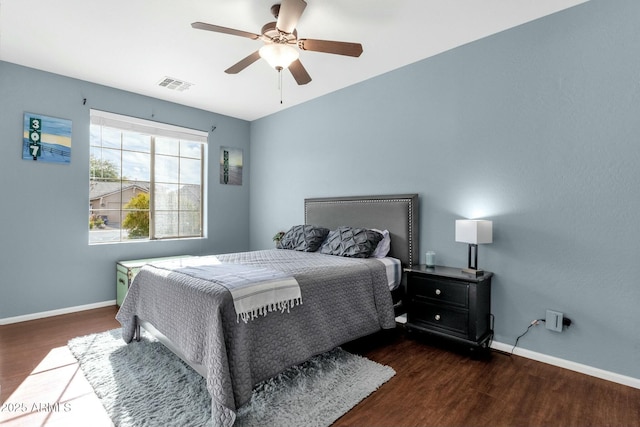 bedroom featuring dark hardwood / wood-style floors and ceiling fan