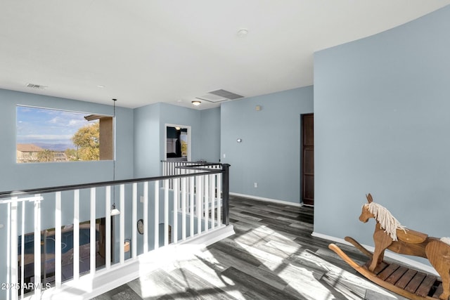 hall with dark wood-type flooring