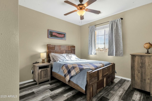bedroom with ceiling fan and dark hardwood / wood-style flooring