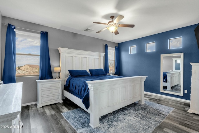 bedroom featuring dark hardwood / wood-style floors and ceiling fan