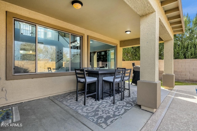 view of patio with a bar