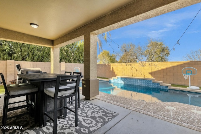 view of patio / terrace featuring a fenced in pool