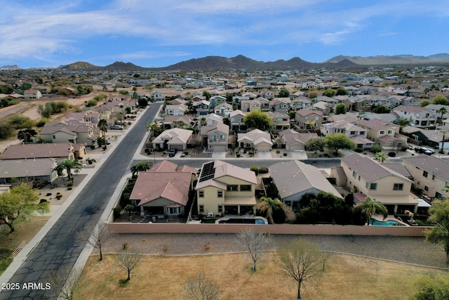 birds eye view of property with a mountain view