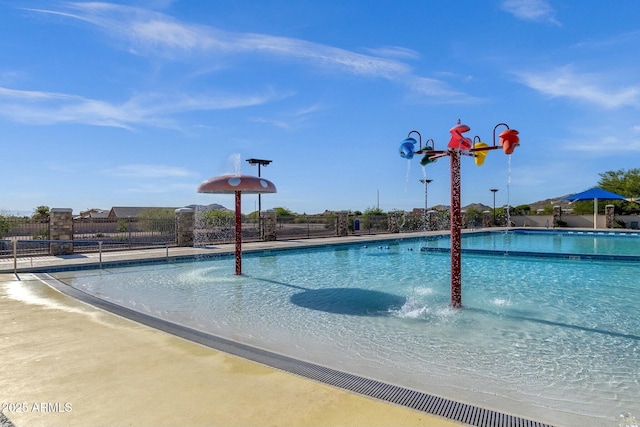view of swimming pool featuring pool water feature
