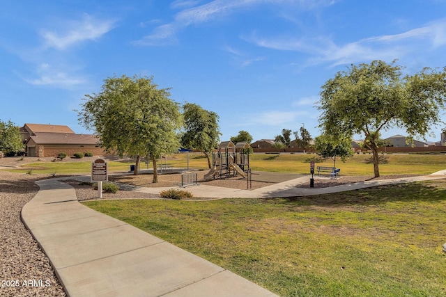 view of community with a lawn and a playground